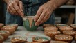 © Ева Поликарпова - A person creates a bowl from clay by hand, with a focus on the creative process