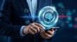 © CuteBee - Corporate executive managing artificial intelligence neural network interface on mobile device in server facility with glowing holographic brain and data icons for analytics