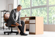© Pixel-Shot - Compression stockings for men, mature businessman putting on medical socks for circulation and vein health in a modern office environment