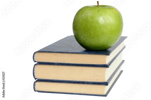 books and green apple