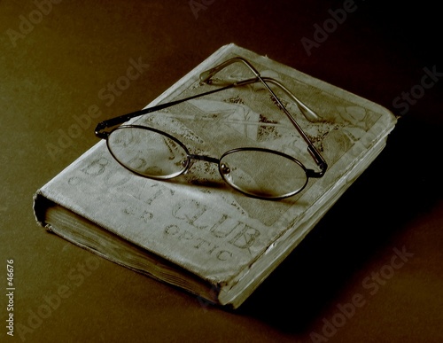 glasses on an old book