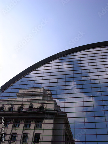 old building reflection on a modern architecture s
