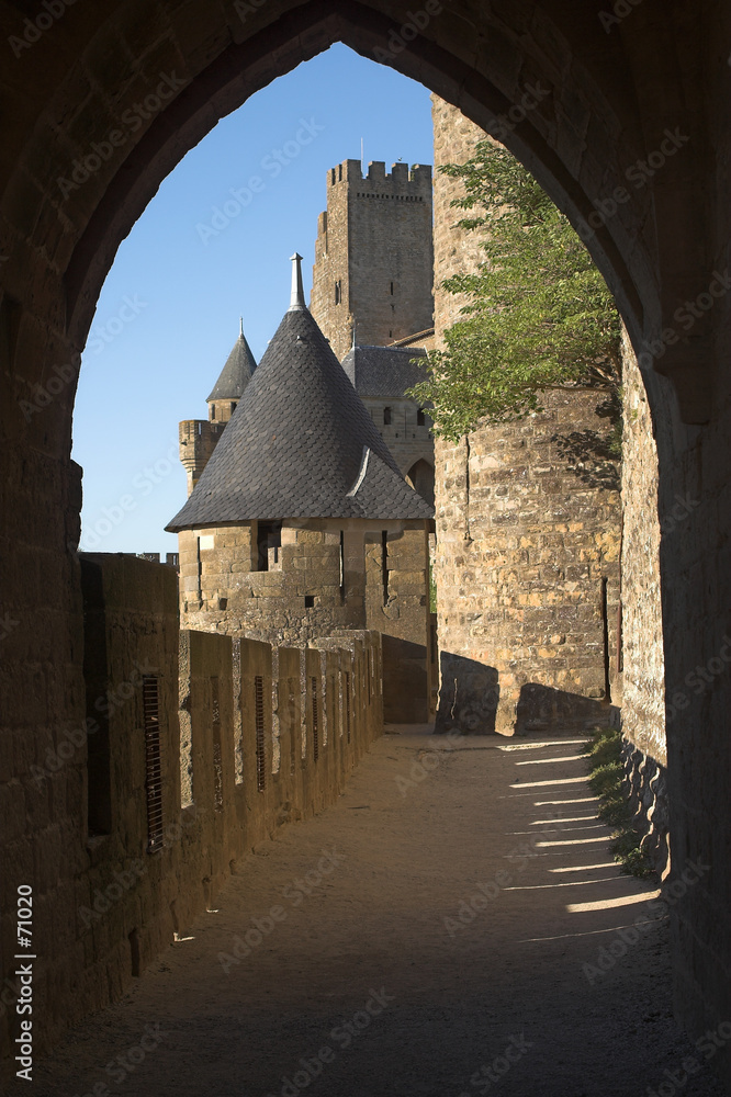 view at carcassonne castle through an archway