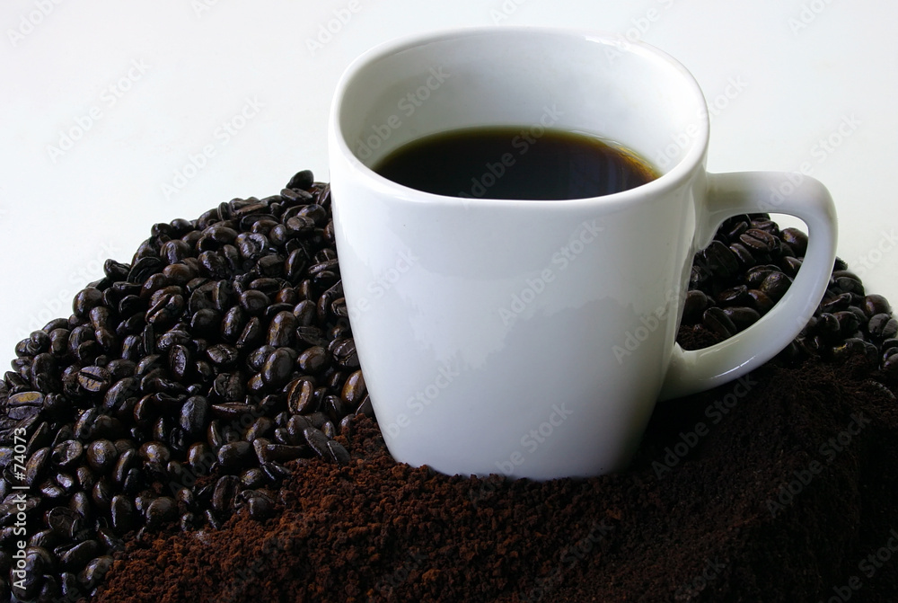 a mug of coffee surrounded by coffee beans a mug of coffee surrounded by coffee beans