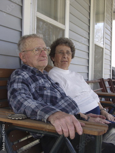 senior couple on front porch