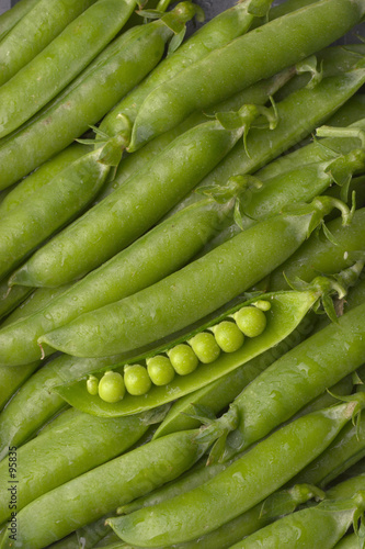 pea pods with one opened pod