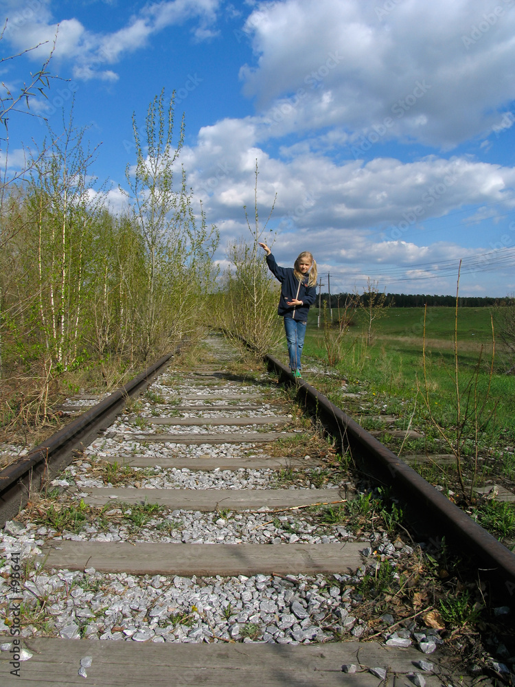 girl  balancing on rail