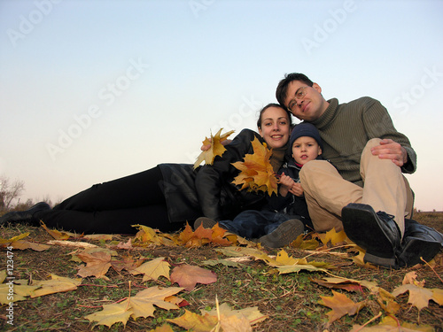 family with autumn leaves photo