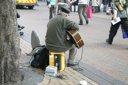 busker with electric guitar