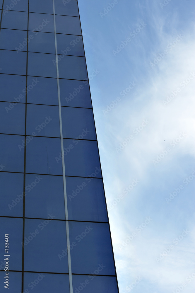 Obraz premium glass office building with blue sky