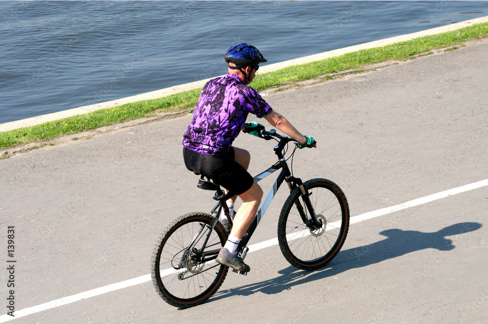 adult man riding on mountain bicycle adult man riding on mountain bicycle