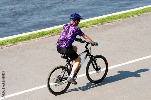 adult man riding on mountain bicycle