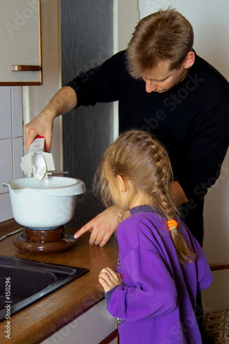 girl cooking with dad
