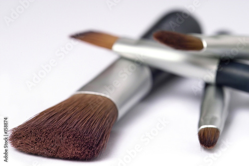 four beauty brushes