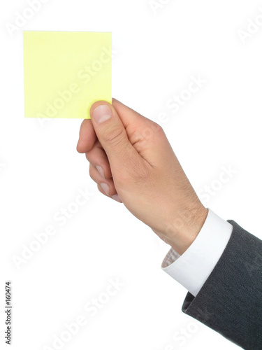 hand holding yellow post-it