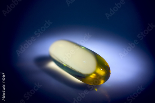 gold pill in spot light