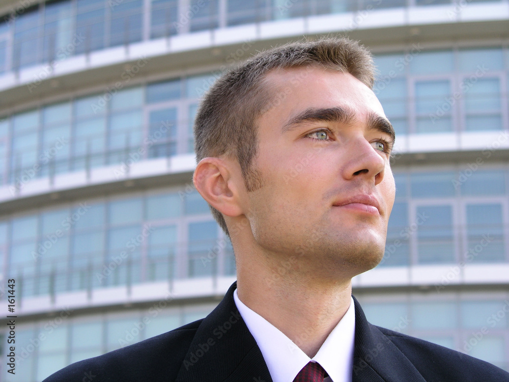businessman outside a modern office building businessman outside a modern office building