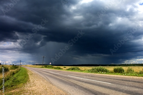 rain clouds near the country road.