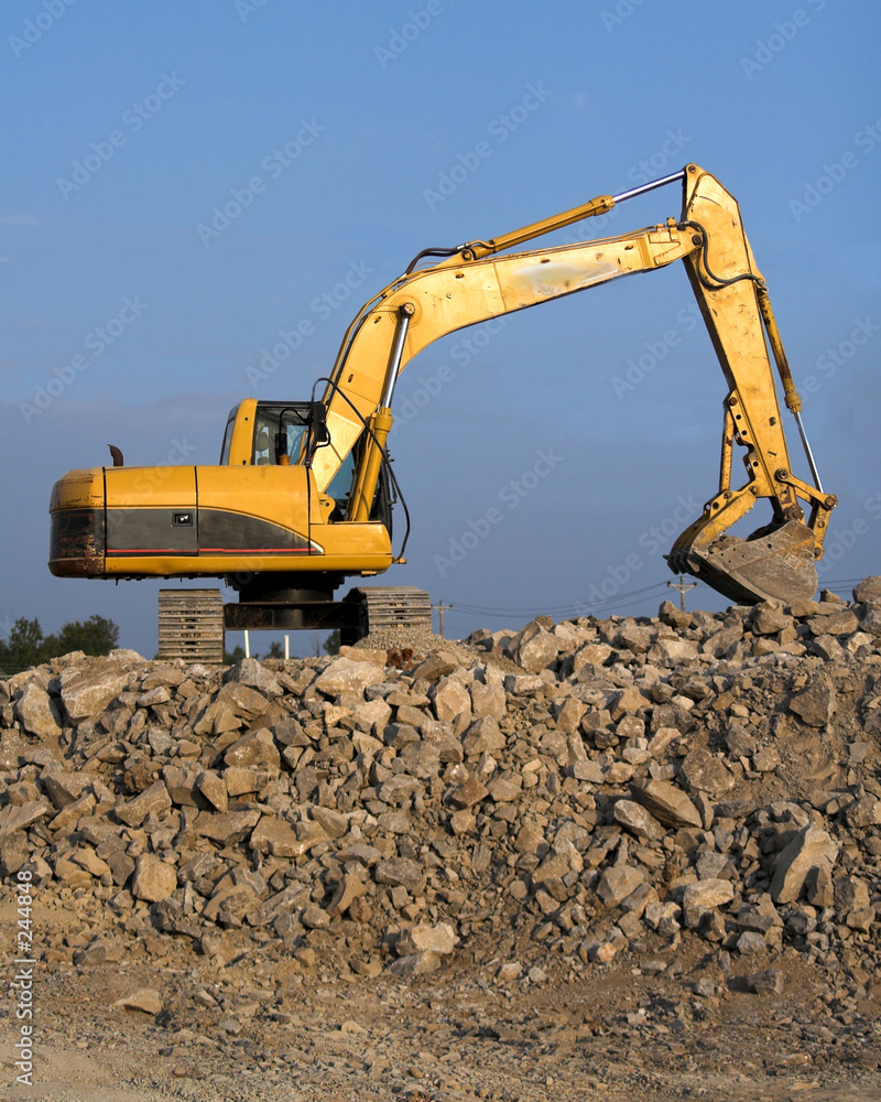 track hoe on rock pile track hoe on rock pile