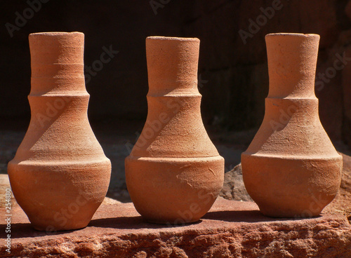 three terracotta bottles