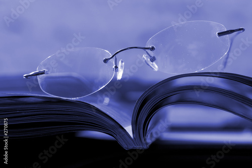 glasses on the magazine