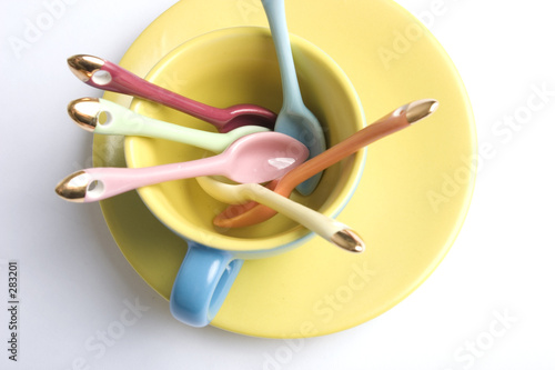 coloured spoons in a coloured cup