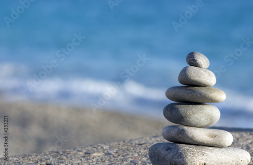 pebbles on the blue sea