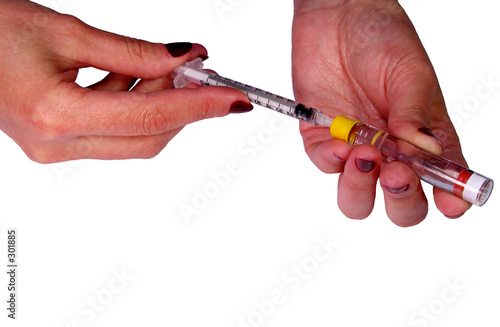 filling syringe with insulin photo