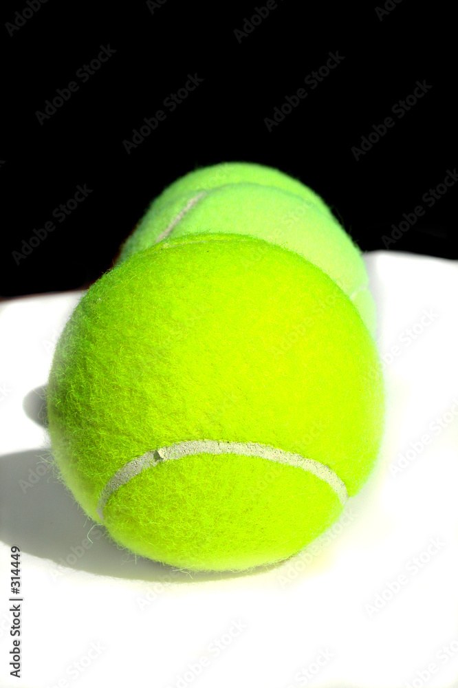 three tennis balls