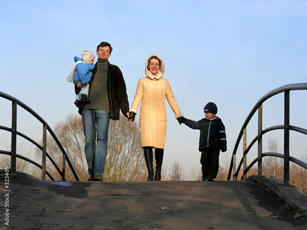 family of four on bridge