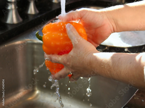 washing orang peppers