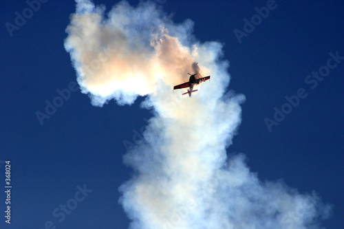 plane in the cloud of smoke