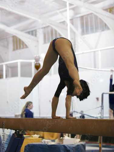 gymnast competing on beam