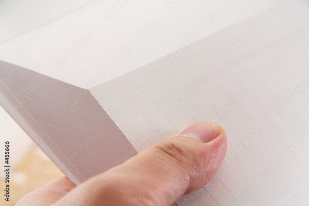 hand turning pages of a book