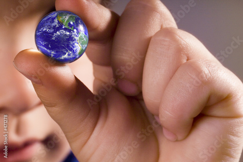 boy holding the world