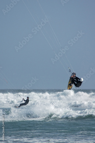 kite surfers riding and jumping