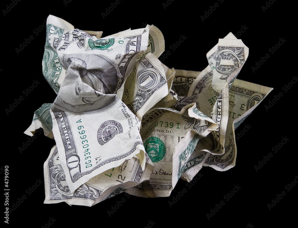 Fotografie crumpled money on black background
