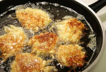 frying latkes for hanukah