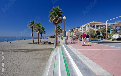 sandy beach and promenade at estepona in southern spain