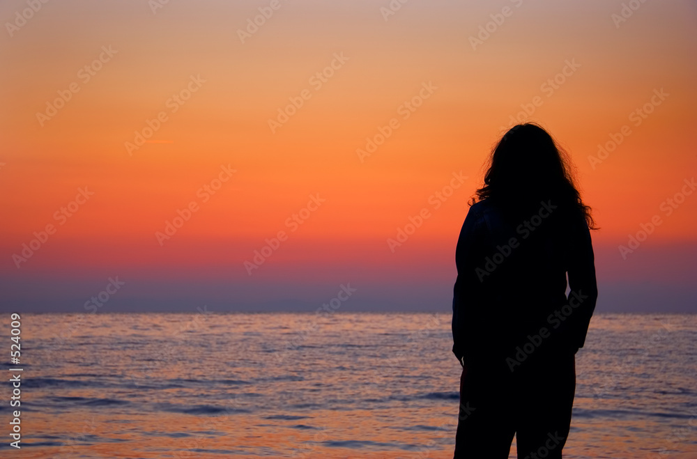 young woman at the beach in the morning