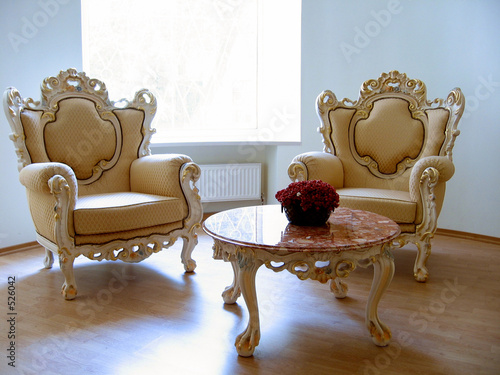 two antique chairs and marble table