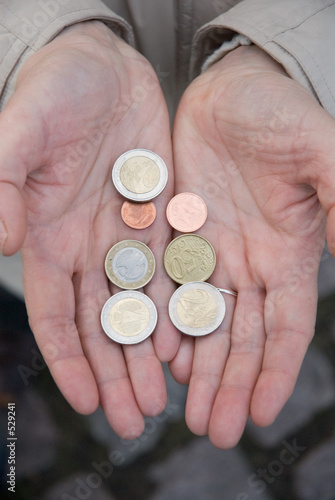 hands with euro coins