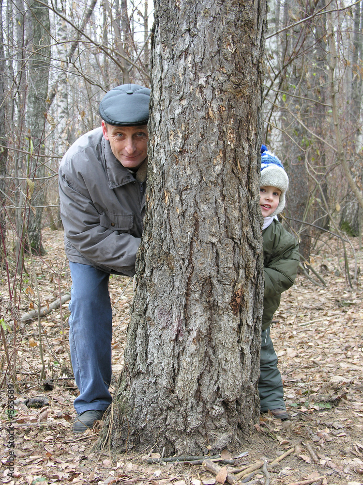 grandfather and grandson play hide-and-seek grandfather and grandson play hide-and-seek
