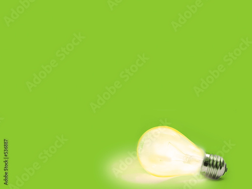 green background with lit lightbulb