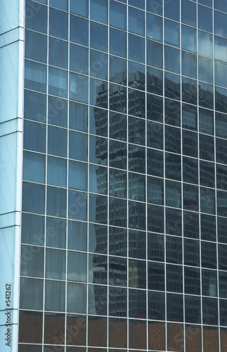 reflection in the windows of office building