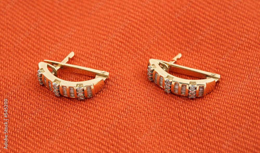 Αυτοκόλλητο jewelery 010 gold earing with diamond red background