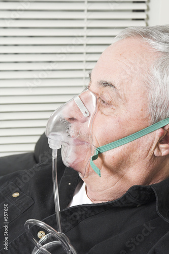 senior with oxygen mask photo