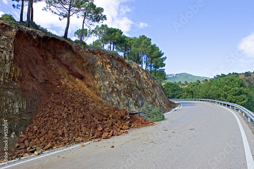 land or mudslide on mountain road after storm