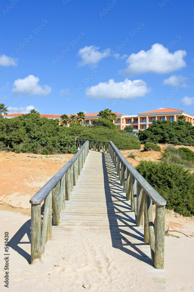 wooden walkway on sandy beach in spain