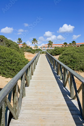wooden walkway on sandy beach in spain